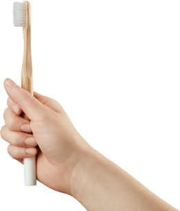 Picture of a hand holding a toothbrush with white text overlay that says "your next steps".